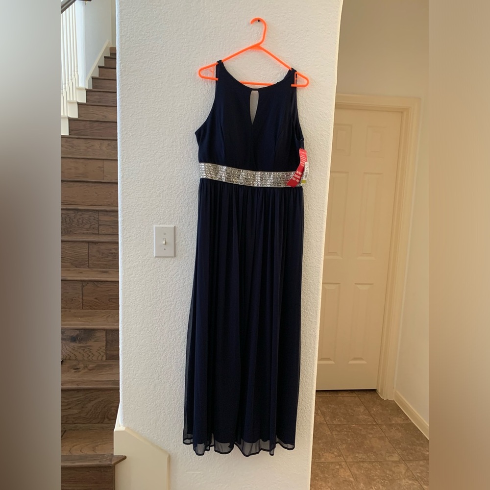 R&M Richard’s beaded gown in the front waist area.